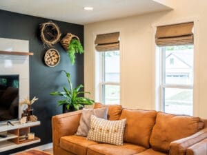Cozy living room with tan leather sofa