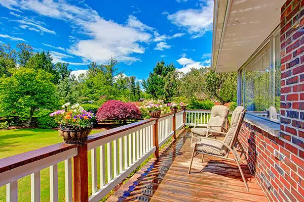 A beautiful view with trees and flowers from the balcony.