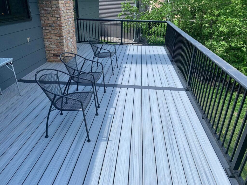 Modern gray composite deck with metal chairs