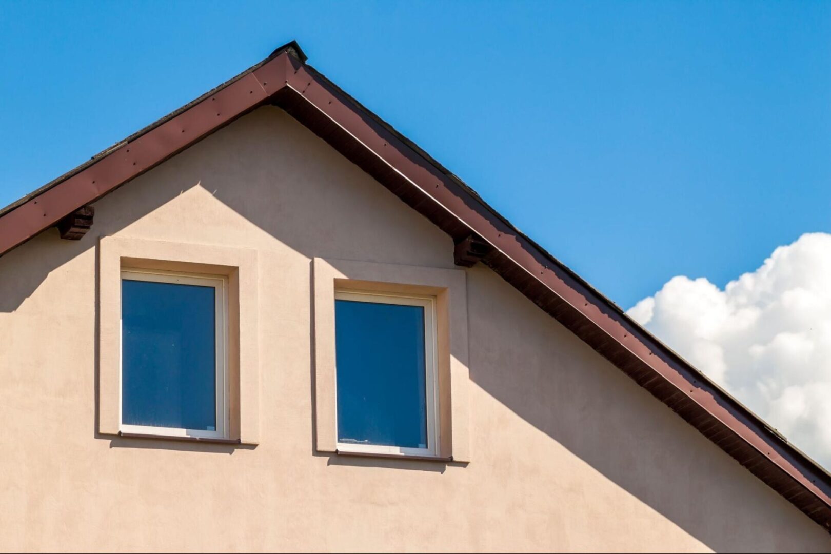 Two windows and residential roofing. 