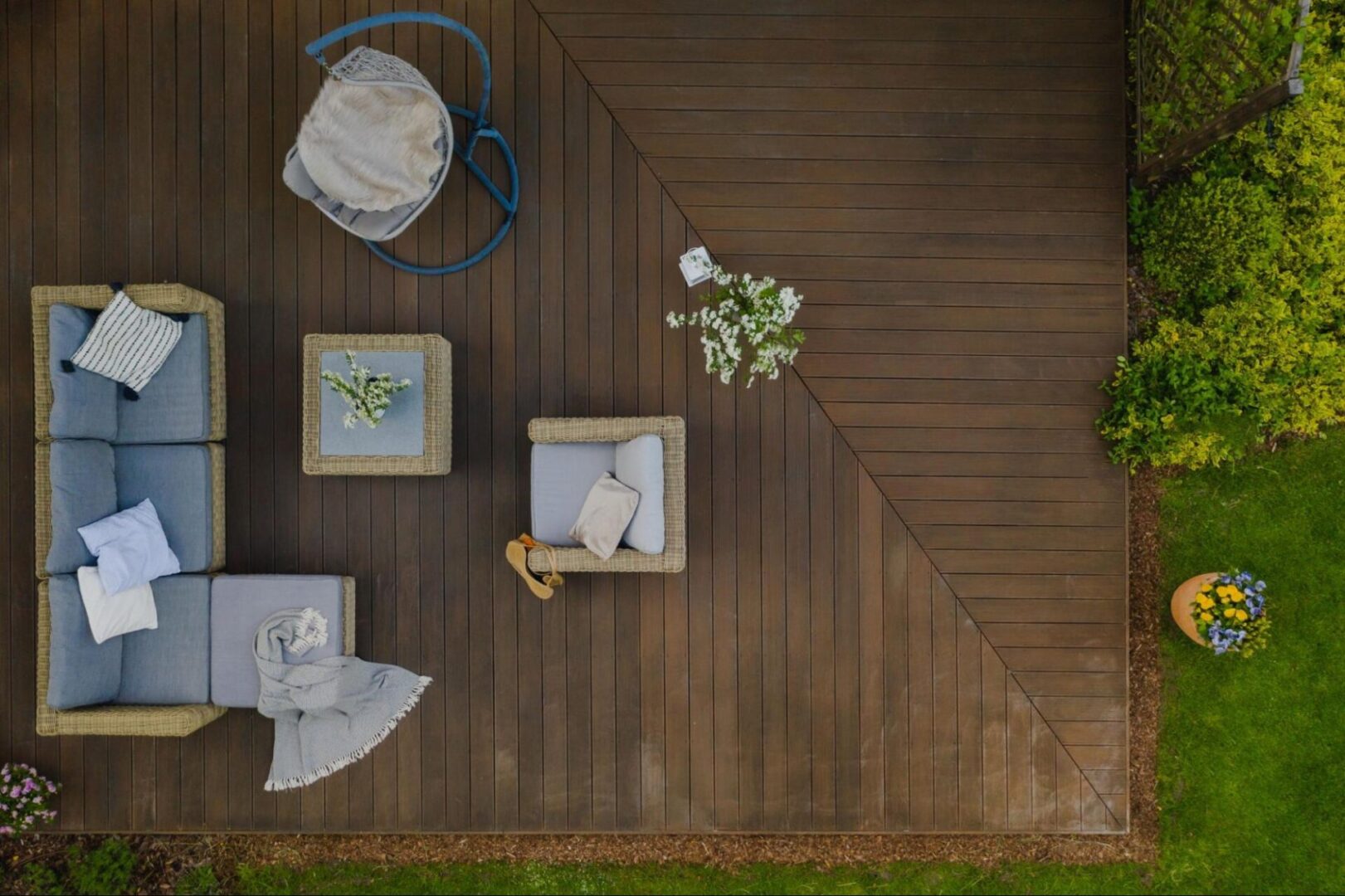 Overhead view of a deck with outdoor furniture. 