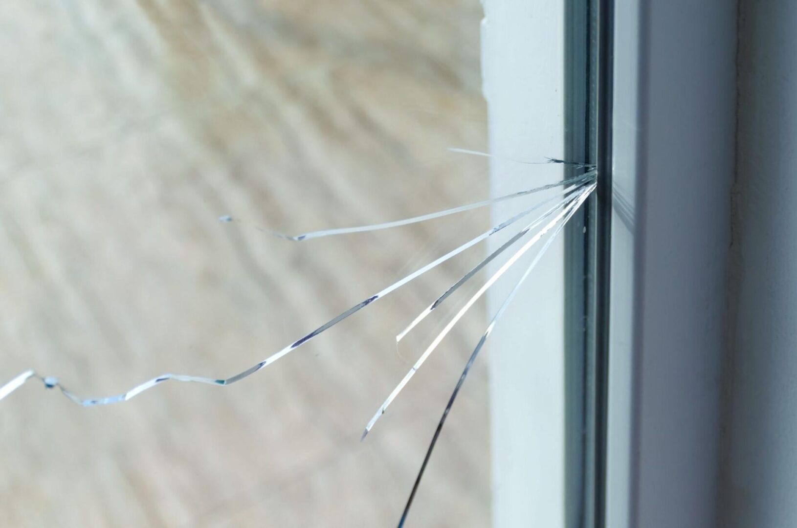 A close-up of a cracked glass window.