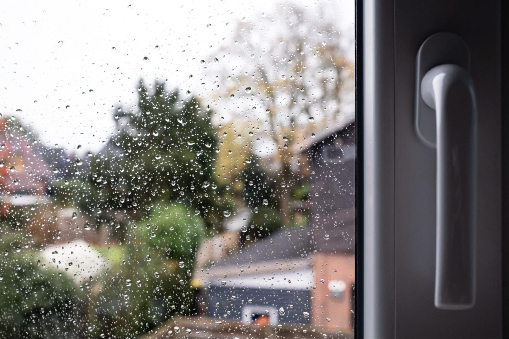 Glass door with rain droplets on the glass. 