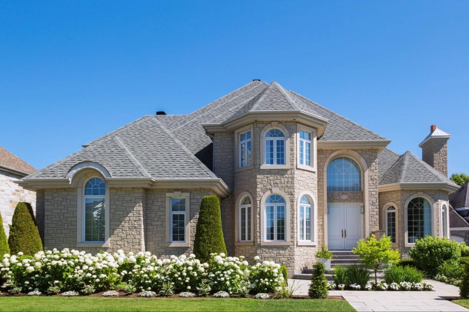 Beautiful two-story home with roofing. 