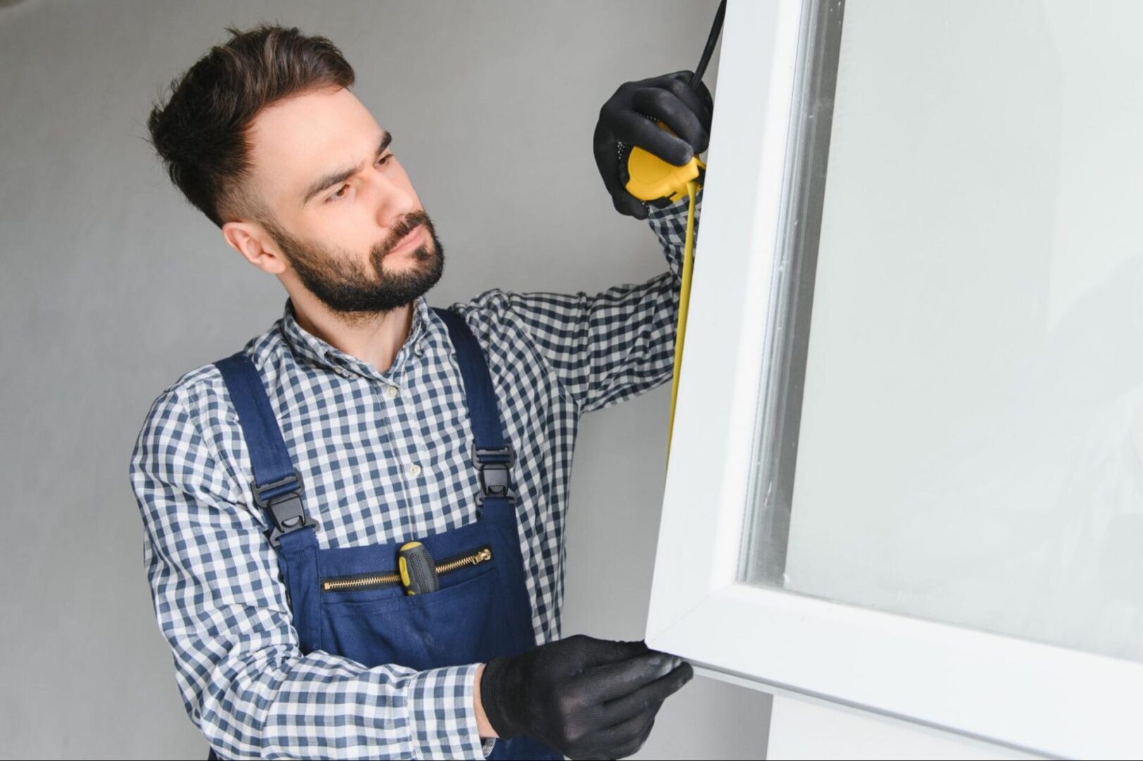 Man replacing a window. 