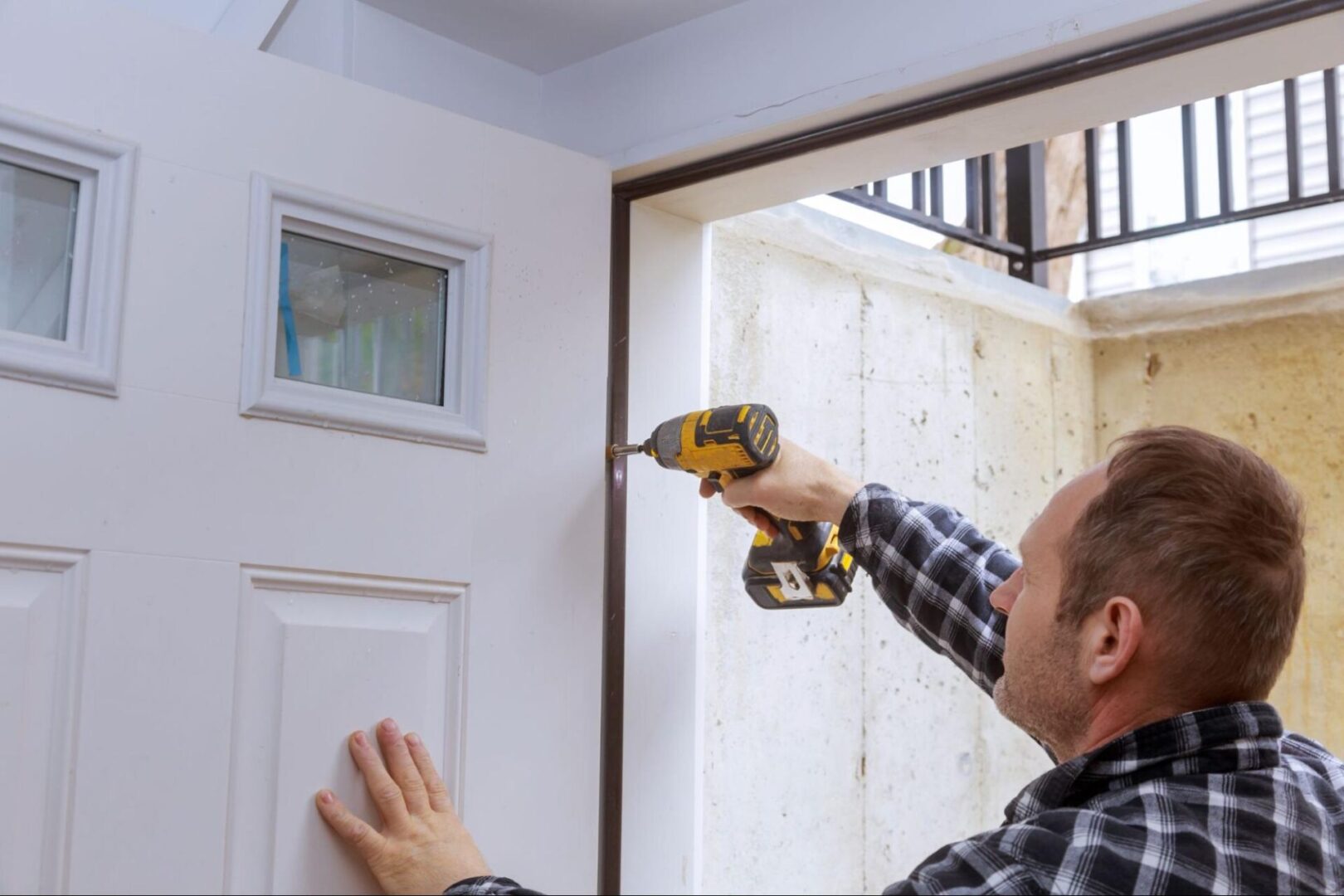 Man Installing door. 