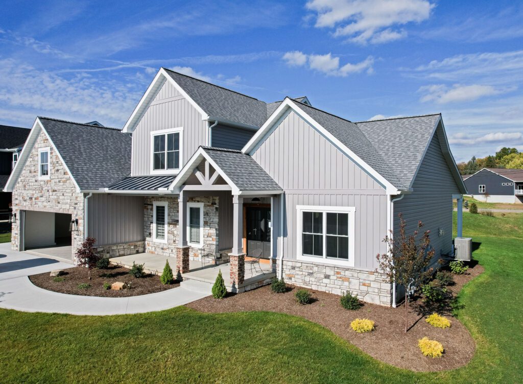 professional siding installation crew working on Pine Island MN home