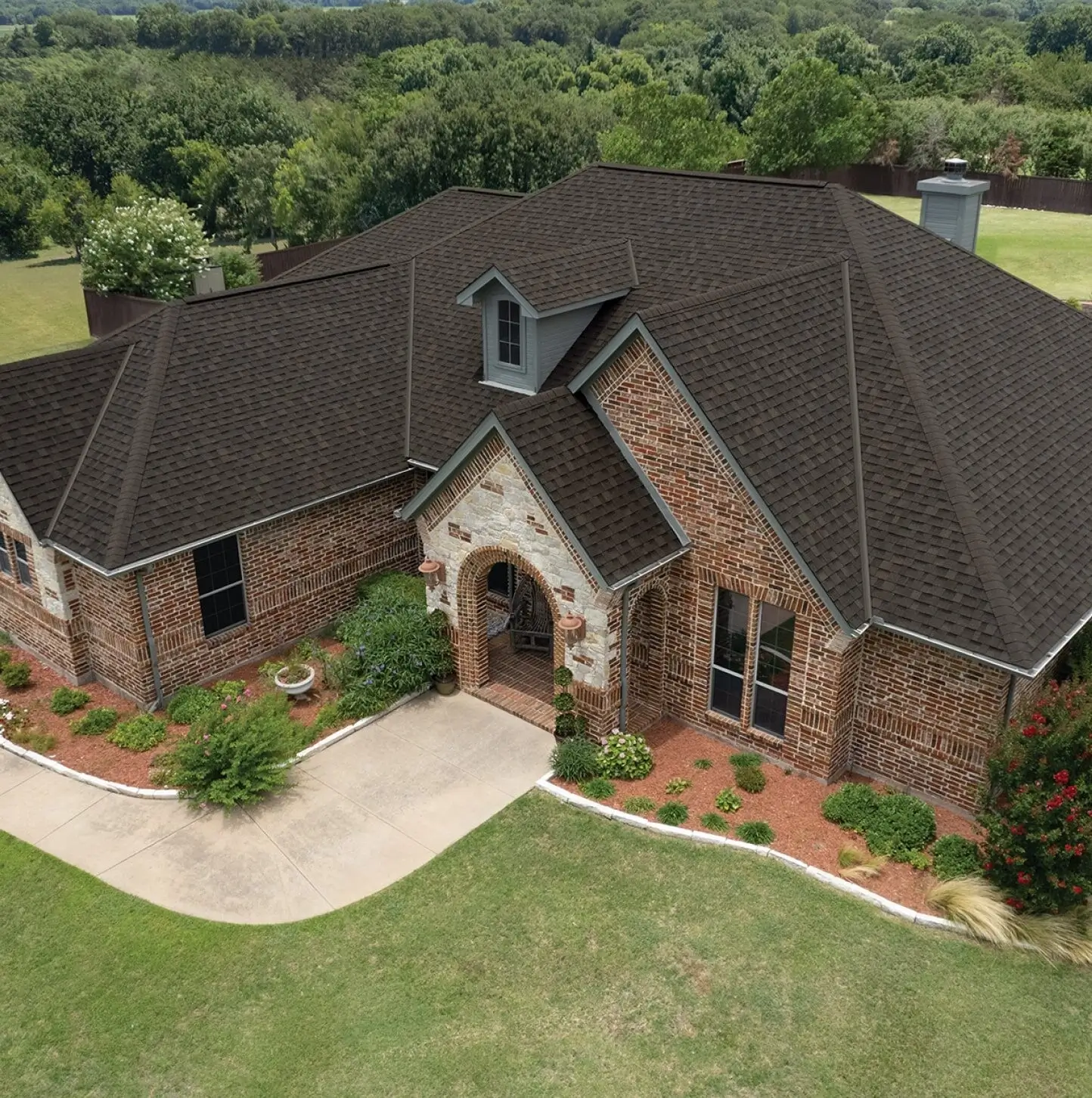 Residential roof installation in Pine Island MN showing professional roofing contractors installing asphalt shingles