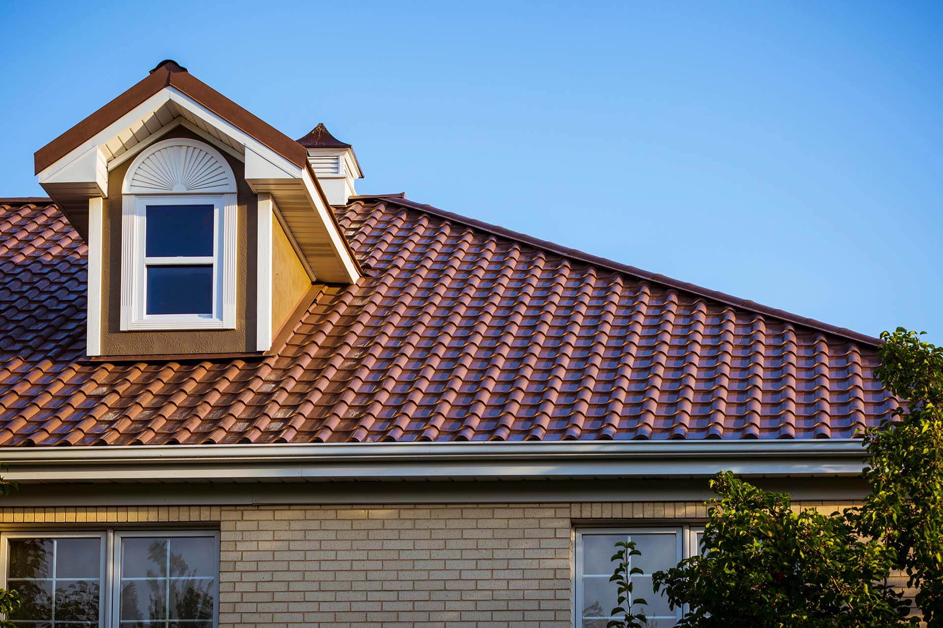 Red tiled roof with white dormer window