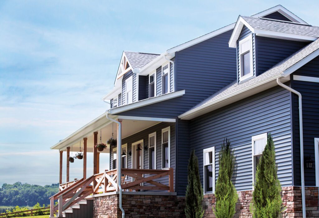 professional siding installation crew working on home in Owatonna MN