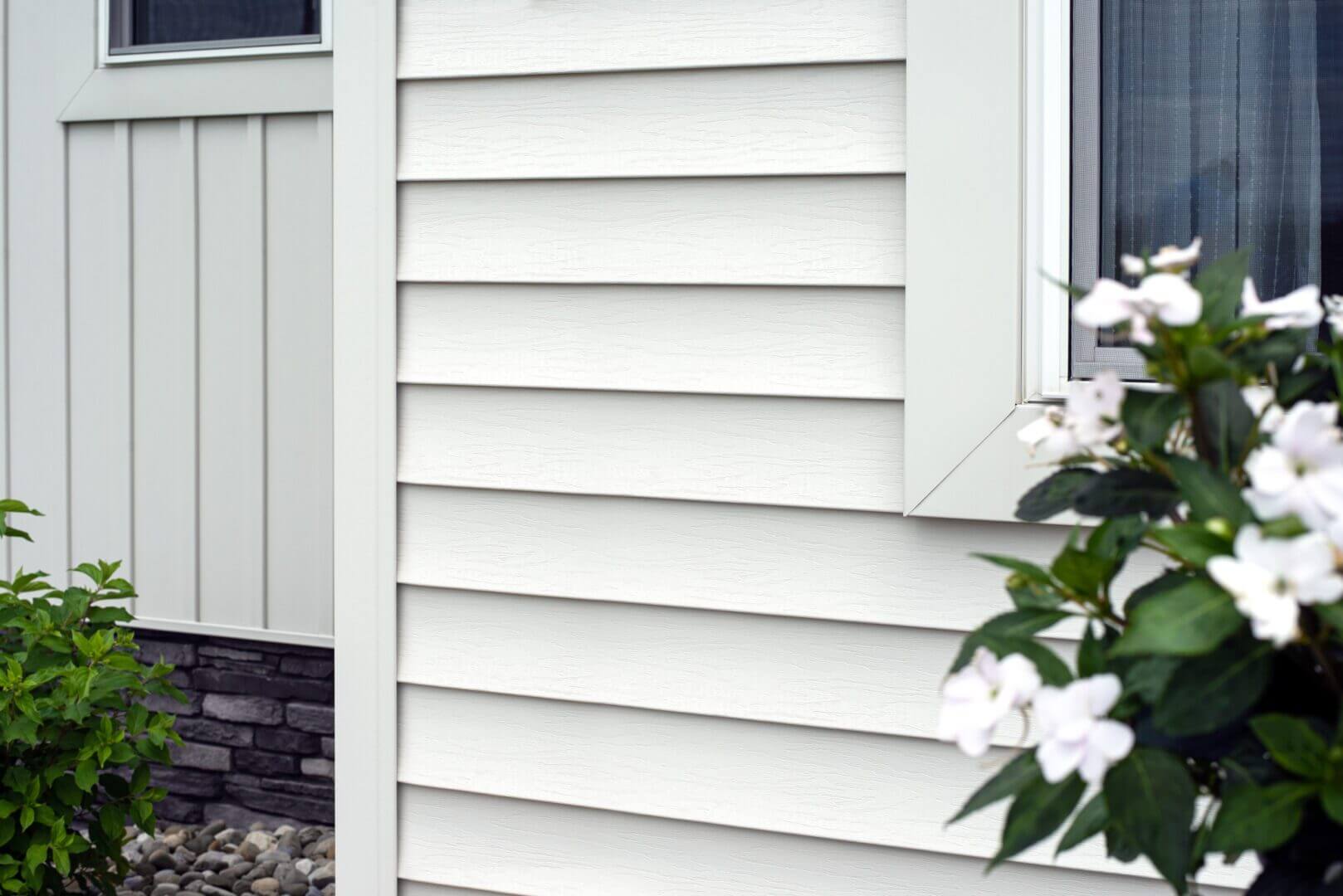 homeowner maintaining siding on residential house in Kasson MN