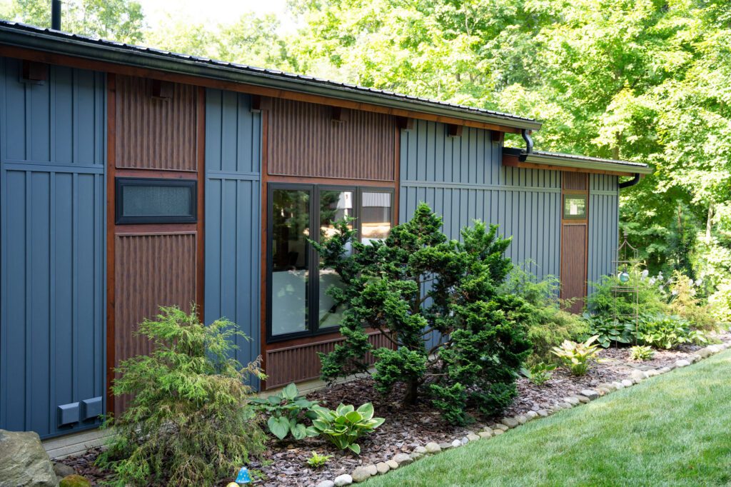 damaged exterior siding on home in Owatonna MN showing signs of wear and replacement needed