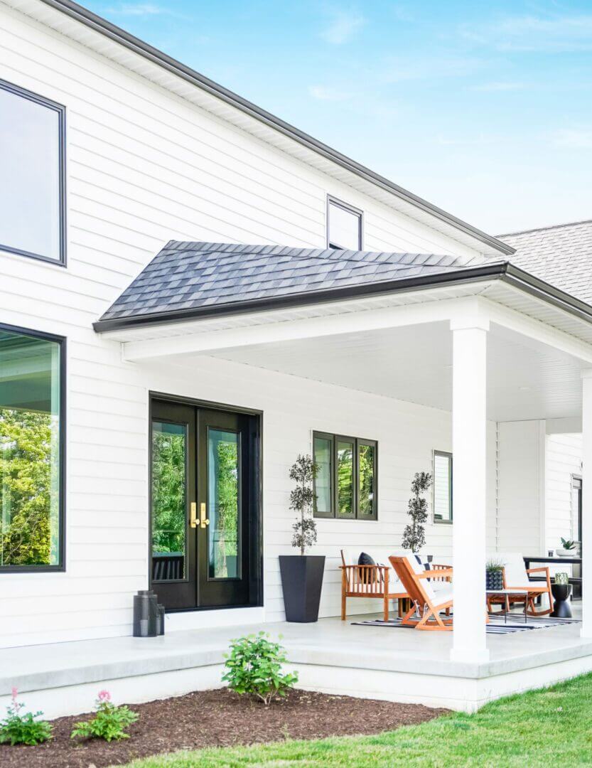 vinyl siding installation contractors working on home exterior in Pine Island MN