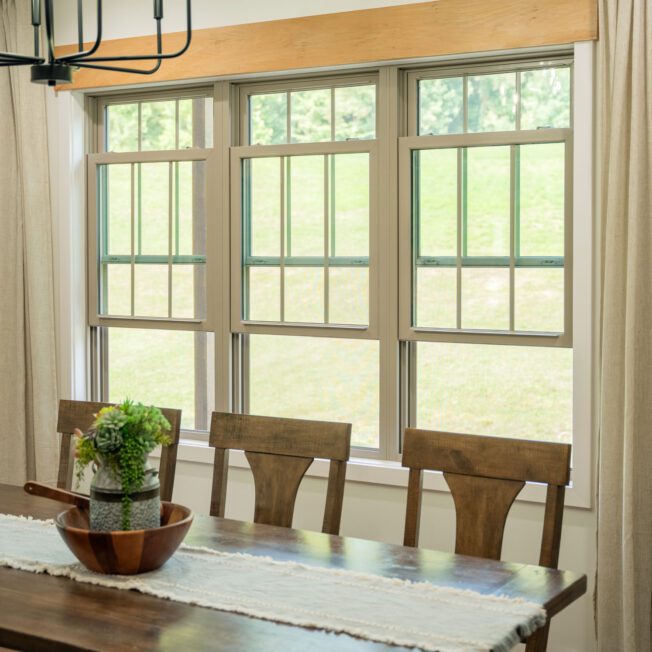 Contractor measuring a window for replacement window estimate in Kasson MN